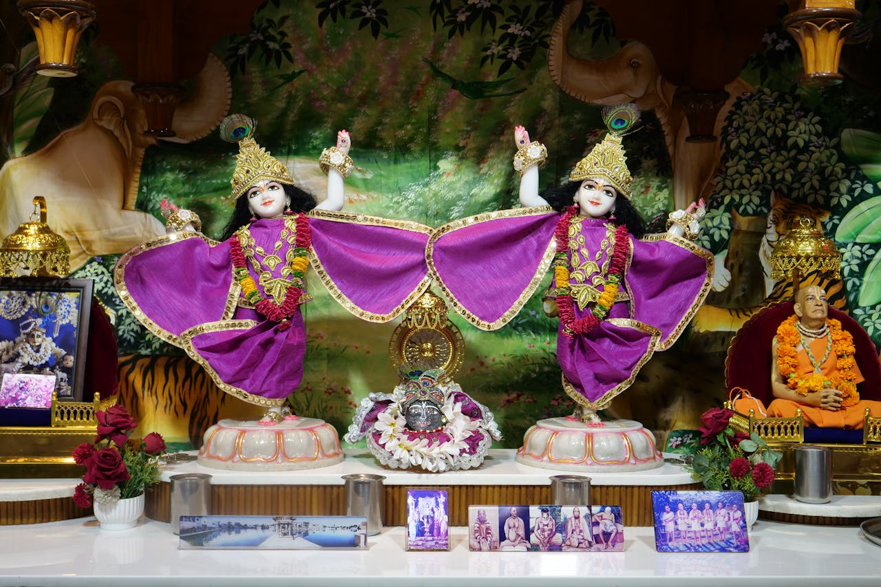 Offerings Beautiful Hindu altar featuring Krishna figurines, vibrant decorations, and religious items for worship.