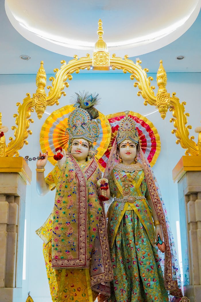 Crafting Captivating Headlines: Your awesome post title goes here Statues of Krishna and Radha in a Thai temple showcasing vibrant traditional art.