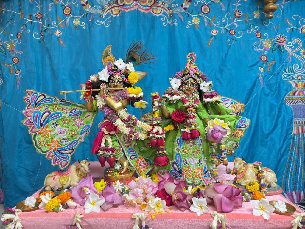 The Art of Drawing Readers In: Your attractive post title goes here Colorful statues of Hindu deities adorned with flowers in a vibrant festival setting.